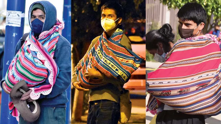 Padres cargan a sus bebés en Aguayo. DICO SOLÍS