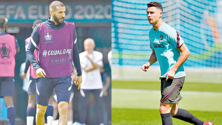 Karin Benzema (i) y Cristiano Ronaldo (d) durante las prácticas en sus selecciones.           EFE