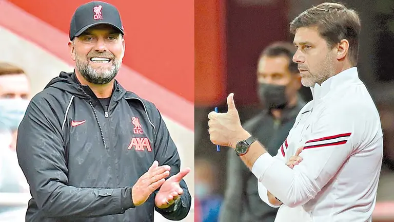 El técnico de Liverpool Jurgen Klopp (i) y el entrenador del PSG, Mauricio Pochettino. ARCHIVO