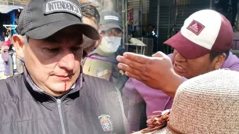 El intendente Enrique Navia (i), golpeado. Del otro, el transe&uacute;nte acusado de reaccionar con violencia contra el funcionario. OPINI&Oacute;N