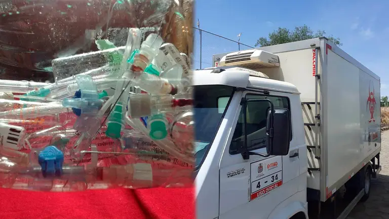 Residuos hospitalarios (i) un cami&oacute;n en espera de entrar al botadero.