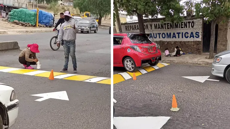 La pareja de venezolanos pinta un rompemuelle en la avenida Independencia. LUCIO HUARANCA