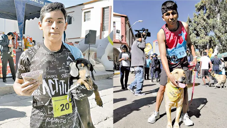 Max y Sansón, los perros ganadores, junto a sus dueños. /  MARIELA COSSÍO